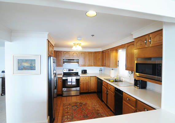 Waterfront 3+ Bed, 2 Bath Apartment. Includes waterfront balcony with seating for 4, fully stocked kitchen, full dining room seating for 8, full living room with harbor and beach views, media room with fireplace, air conditioning and heating, WiFi, iHome, Comcast TV/DVD.