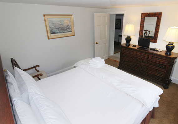 Waterfront 3+ Bed, 2 Bath Apartment. Includes waterfront balcony with seating for 4, fully stocked kitchen, full dining room seating for 8, full living room with harbor and beach views, media room with fireplace, air conditioning and heating, WiFi, iHome, Comcast TV/DVD.