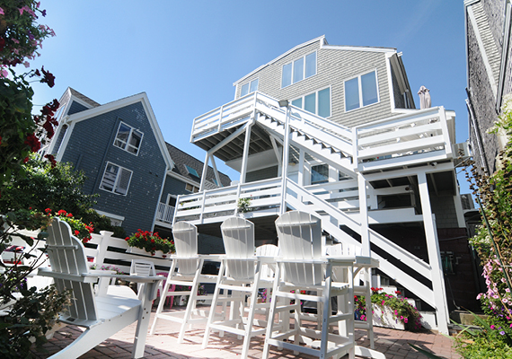 Waterfront 3+ Bed, 2 Bath Apartment. Includes waterfront balcony with seating for 4, fully stocked kitchen, full dining room seating for 8, full living room with harbor and beach views, media room with fireplace, air conditioning and heating, WiFi, iHome, Comcast TV/DVD.